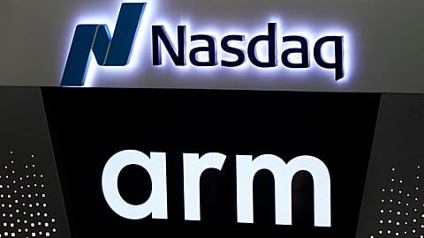The logos for ARM Holdings and the Nasdaq are shown during the ARM Holdings IPO, in New York's Times Square, Thursday, Sept. 14, 2023.