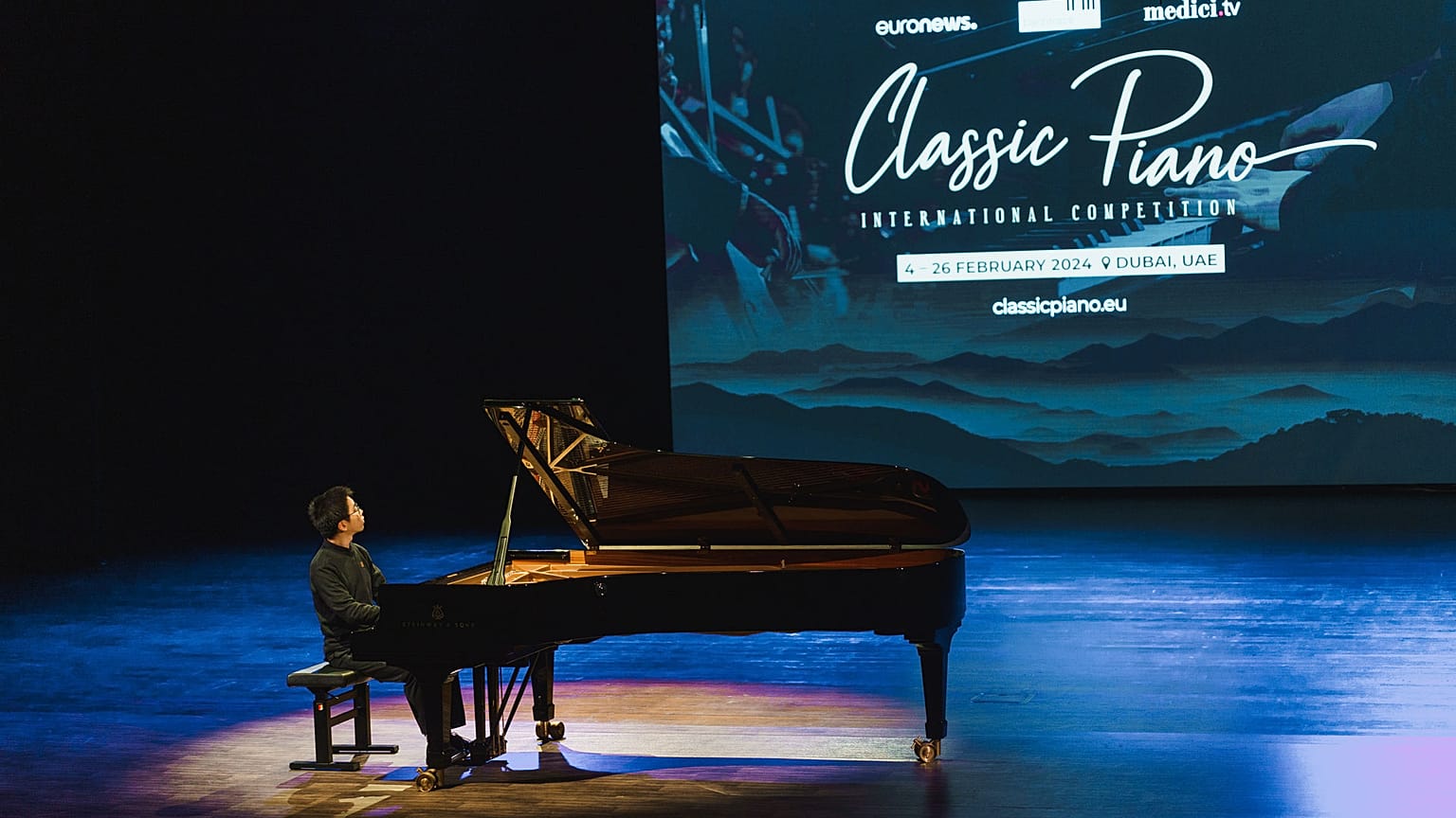 A musician plays the piano.