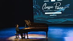 A musician plays the piano.