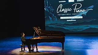 A musician plays the piano.