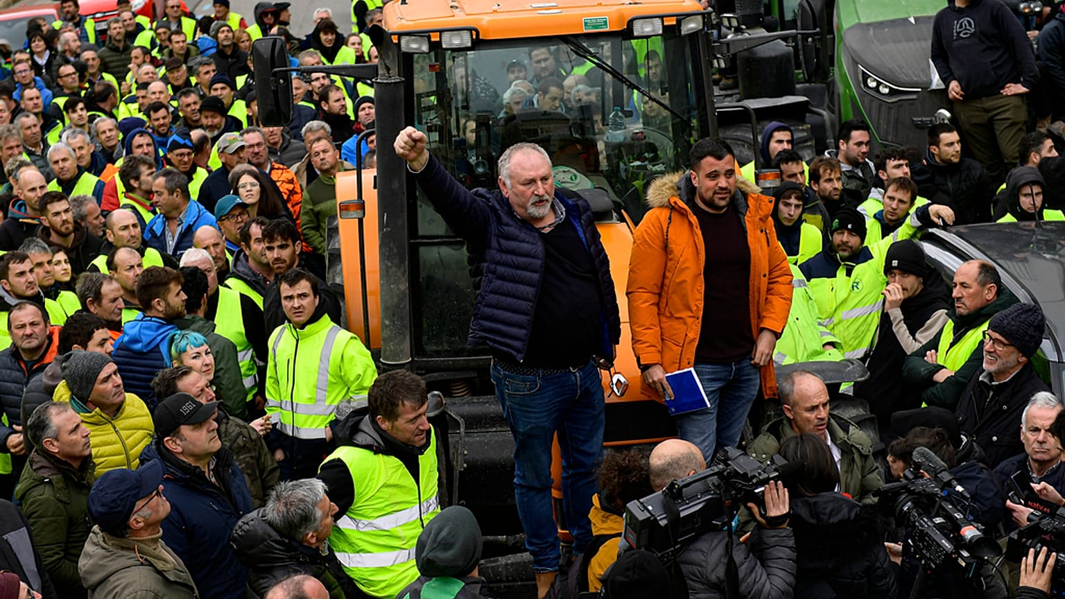 Farmers with their tractors attend a protest in Pamplona, northern Spain, Friday, Feb. 9, 2024. For fourth non stop days, farmers in Spain have staged tractor protests across 