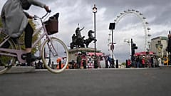 A woman rides a bike in London, Thursday, Nov. 17, 2022. 