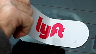 In this Jan. 31, 2018, file photo, a Lyft logo is installed on a Lyft driver's car in Pittsburgh.