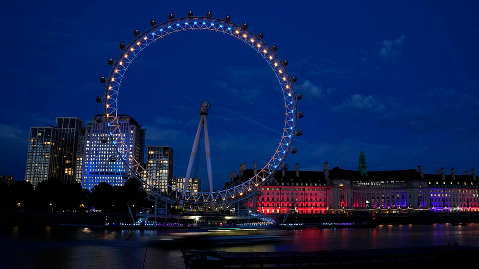 The London Eye lit up in the colors of the Ukraine to mark their Independence Day in London, Wednesday, Aug. 24, 2022. 