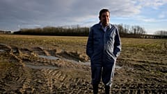 Bart Dochy stands in front of one of the fields at his family farm in Ledegem, Belgium.