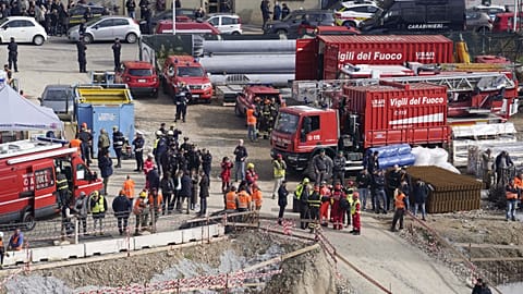 Rescue workers arrive at the scene of an accident at a construction site in Florence, Italy, Friday Feb. 16, 2024.
