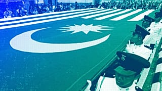 Malaysians hold a giant national flag during the 57th National Day celebrations at Independence Square in Kuala Lumpur, August 2014