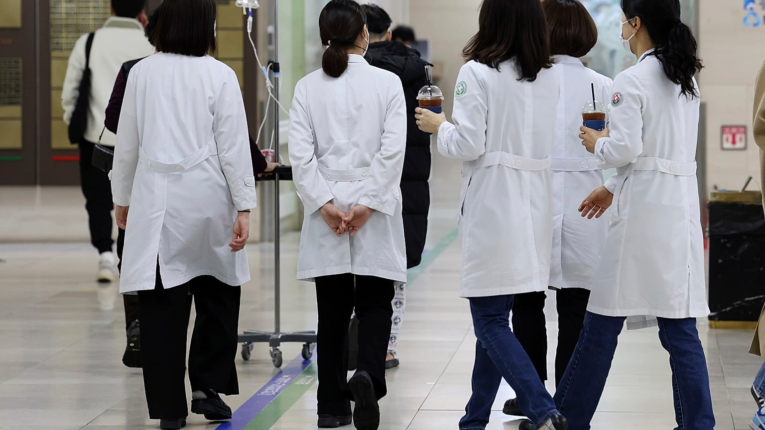 Medical workers walk inside a general hospital in Gwangju, South Korea.