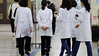 Medical workers walk inside a general hospital in Gwangju, South Korea.