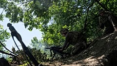  A Ukrainian marine of 35th brigade fires by automatic grenade launcher AGS-17 towards Russian positions on the outskirts of Avdiivka, Ukraine, on June 19, 2023.