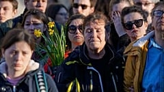 People attend a protest in front of Russian embassy in Belgrade, Serbia, Friday, Feb. 16, 2024. 