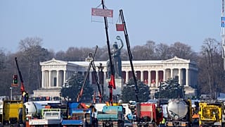 Truck drivers take part in a protest rally against the German government's climate and tax policies on the Theresienwiese, in Munich, Germany, Friday Jan. 12, 2024.