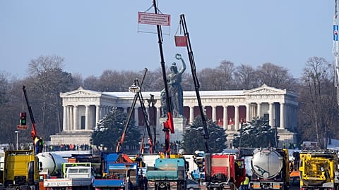 Truck drivers take part in a protest rally against the German government's climate and tax policies on the Theresienwiese, in Munich, Germany, Friday Jan. 12, 2024. 
