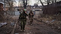 Ukrainian soldiers walk along a street in the area of the heaviest battles with the Russian invaders in Bakhmut, Donetsk region, Ukraine, Wednesday, 15 March, 2023. 