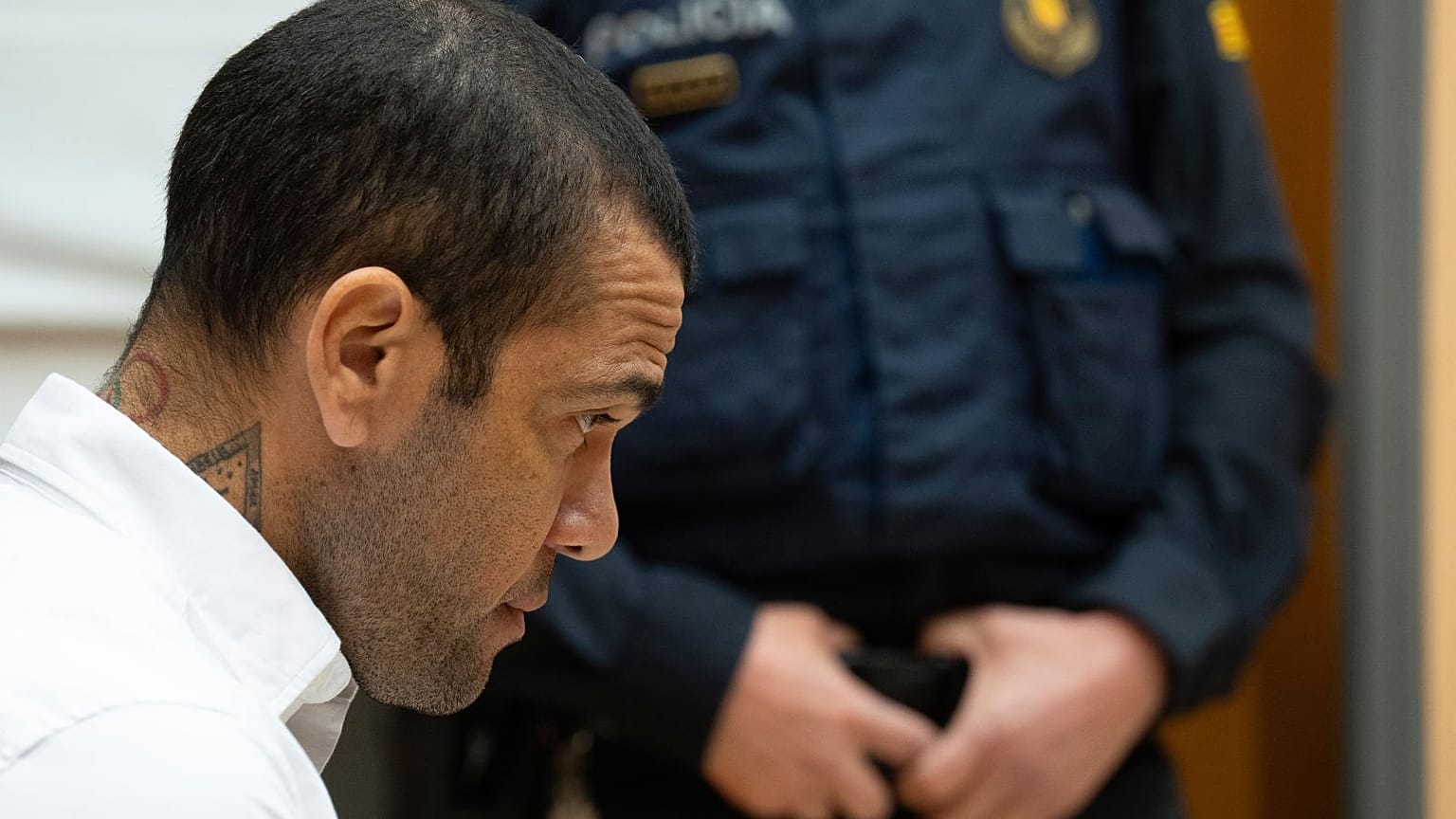 Brazilian soccer star Dani Alves sits during his trial in Barcelona, Spain, Monday, Feb. 5, 2024. 