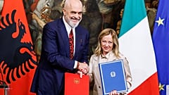 Italy's Prime Minister Giorgia Meloni her Albanian counterpart Edi Rama shake hands after signing a memorandum of understanding on migrant management centres.