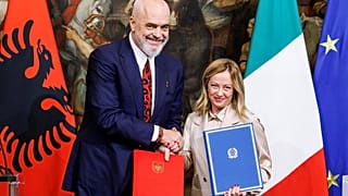 Italy's Prime Minister Giorgia Meloni her Albanian counterpart Edi Rama shake hands after signing a memorandum of understanding on migrant management centres.