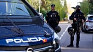 FILE: Police officers stand guard as they cordon off the area in Madrid, 30 November 2022