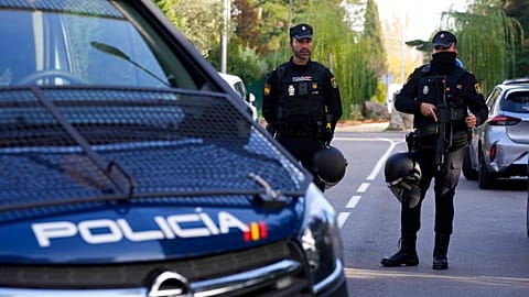 FILE: Police officers stand guard as they cordon off the area in Madrid, 30 November 2022