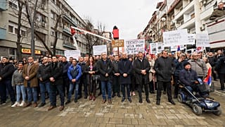Kosovo Serbs protest against a ban of the use of the Serbian currency in areas where they live