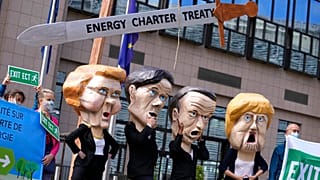 Protesters outside the EU Council headquarters in Brussels in 2021 demand withdrawal from the Energy Charter Treaty. Some now sense victory is in sight.