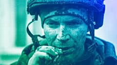 A Ukrainian serviceman who recently returned from the trenches of Bakhmut smokes a cigarette in Chasiv Yar, March 2023