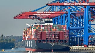 In this Monday, Oct. 15, 2018 file photo, a container ship is loaded at the harbor in Hamburg, Germany.