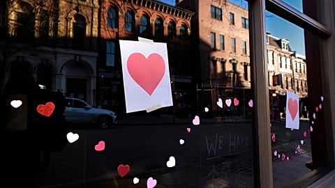 Valentine's Day Hearts decorate a storefront on Exchange Street, Wednesday, Feb. 14, 2024, in Portland, Maine. 