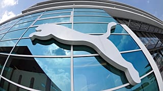 the logo of the German sporting goods producer Puma is pictured on a building at the headquarters in Herzogenaurach, southern Germany, April 20, 2010.