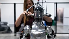AI engineer Jenna Reher works on humanoid robot Figure 01 at Figure AI's test facility.