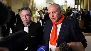 Taxi driver Mostafa Salhane, right, answers journalists with his lawyer Claude Lienard at the Paris' courthouse for the Strasbourg Attack Trial, in Paris, Feb. 29, 2024