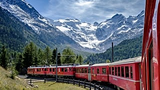 The Bernina Express passes by the stunning Morteratsch Glacier in Switzerland