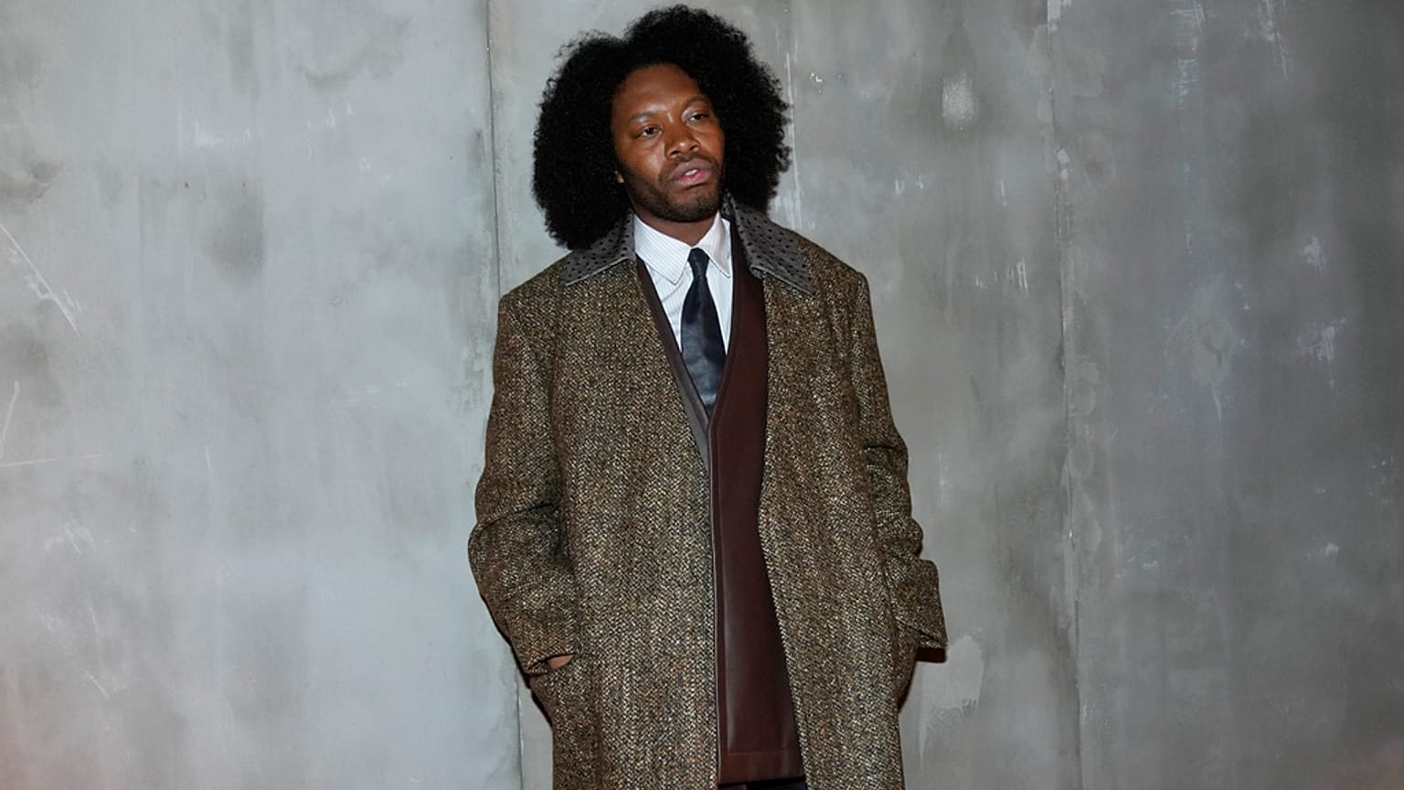 Jeremy O. Harris poses for photographers prior to the start of the Bottega Veneta women's Fall-Winter 2024-25 collection presented in Milan, Italy, Feb. 24, 2024.