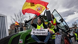 Farmers rally towards the European Parliament offices in Madrid, Spain, Monday, Feb. 26, 2024.