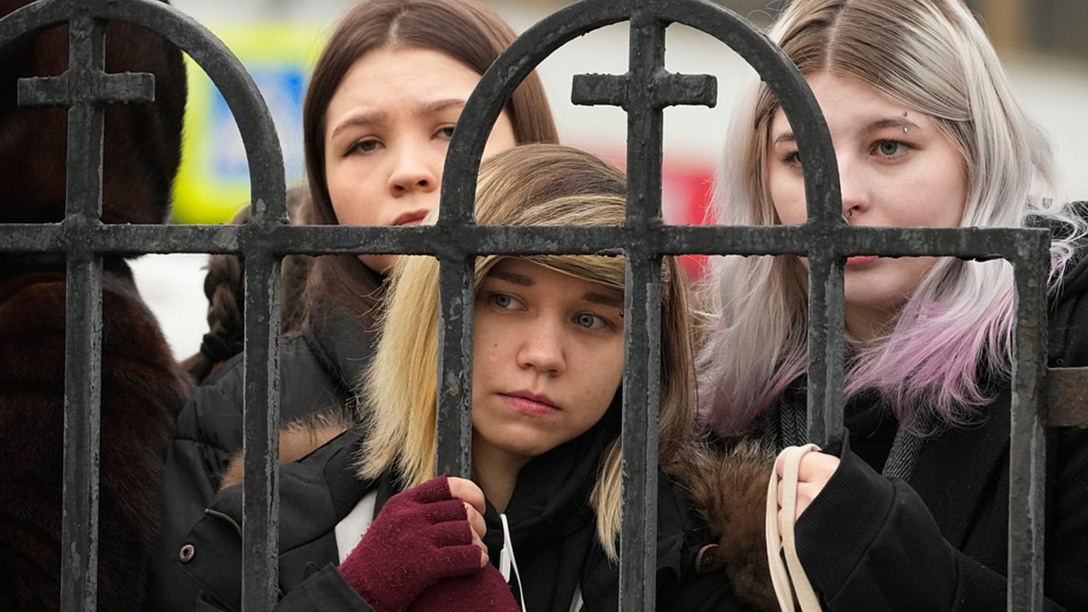 People gather outside the Church of the Icon of the Mother of God Soothe My Sorrows, in Moscow, Russia, Friday, March 1, 2024.