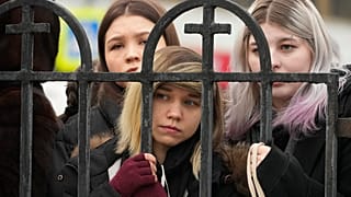 People gather outside the Church of the Icon of the Mother of God Soothe My Sorrows, in Moscow, Russia, Friday, March 1, 2024.