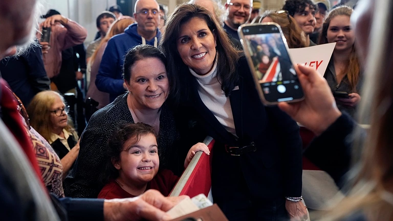 Republican presidential candidate former UN Ambassador Nikki Haley poses for a selfie after speaking at a campaign event in South Burlington, Vermont, Sunday, March 3, 2024.