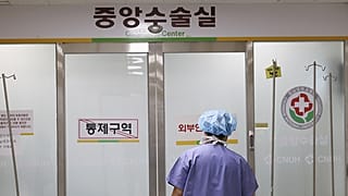 A medical worker enters the operating room at a hospital in Gwangju, South Korea, Monday, March 4, 2024.