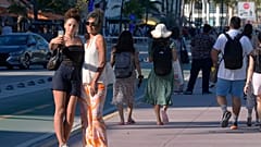 Friends take a selfie on Ocean Drive, Miami Beach, in February