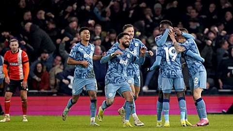 Aston Villa's Lucas Digne, right, is congratulated by his team mates after scoring his sides third goal in a match between Luton Town and Aston Villa, Saturday, March 2, 2024.