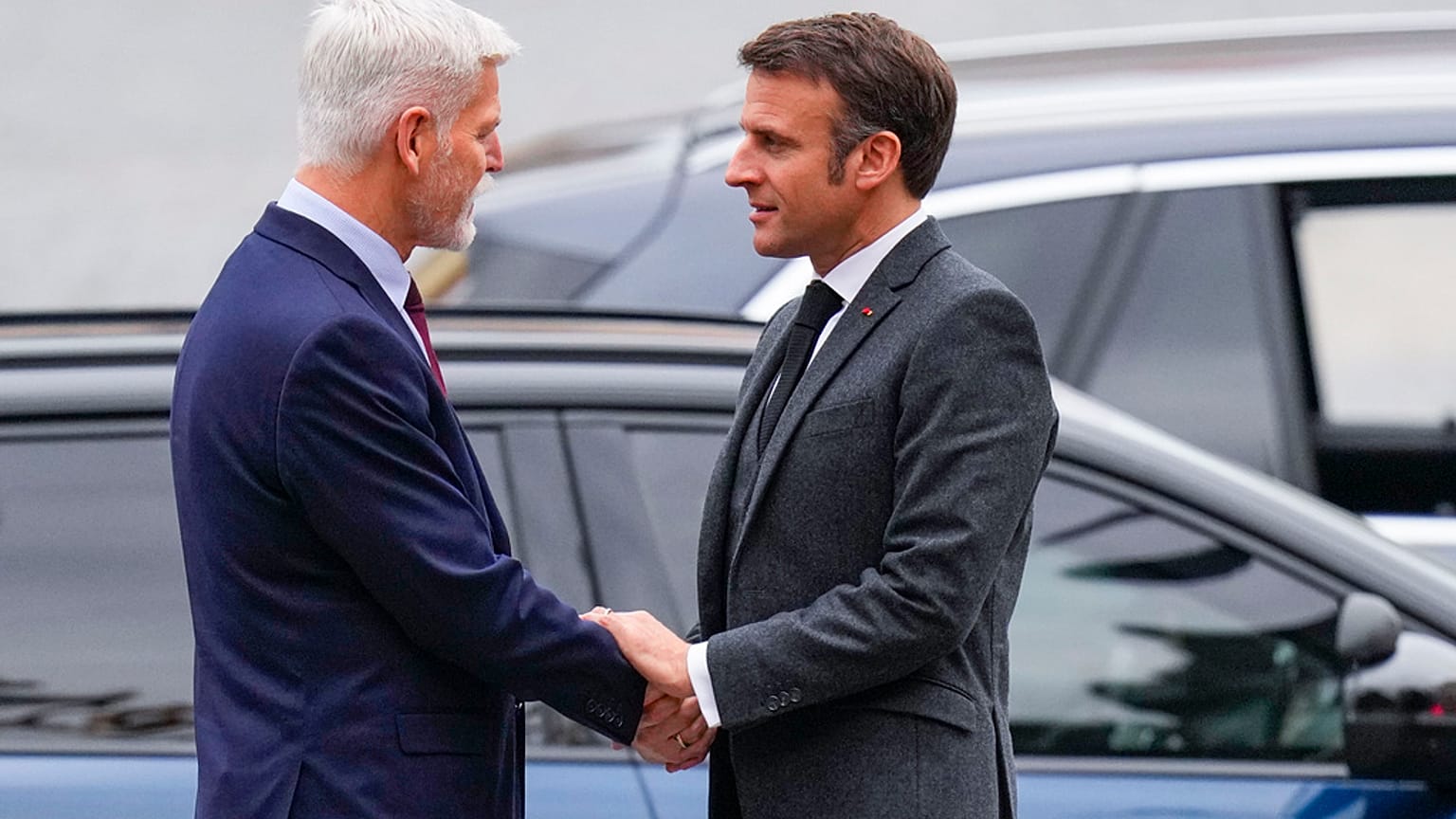 Czech Republic's President Petr Pavel, left, shakes hands with his French counterpart Emmanuel Macron at the Prague Castle in Prague, Czech Republic, Tuesday, March 5, 2024.