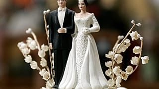Leann and Bob Adams' bride and groom figurines on top of their 50-year-old wedding cake top photographed in their home Friday morning 