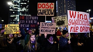 People march in silence to commemorate Lizaveta, a 25-year-old Belarusian woman who died after a being brutally attacked and raped on the streets of Warsaw