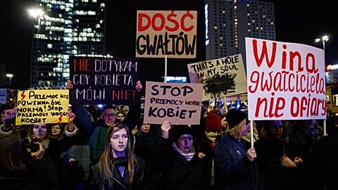 People march in silence to commemorate Lizaveta, a 25-year-old Belarusian woman who died after a being brutally attacked and raped on the streets of Warsaw