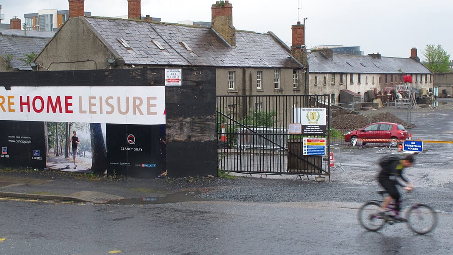 A cyclist passes one of Dublin's many unfinished and bankrupt private housing developments on Thursday, April 26, 2012. 