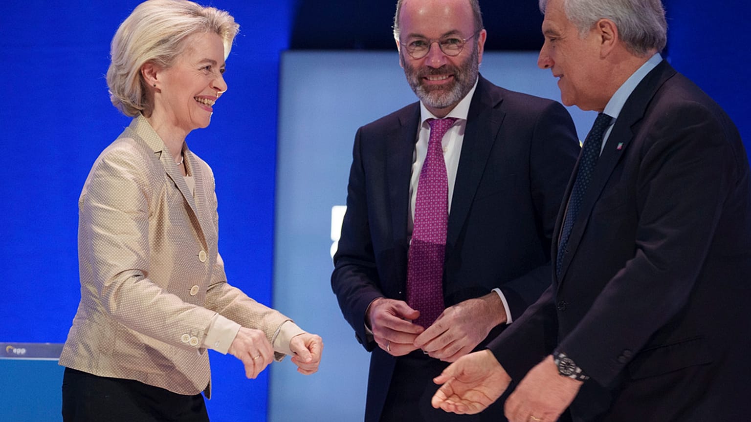 Italy's Deputy Prime Minister greets EU Commission President Ursula von der Leyen as Manfred Weber smiles, at the EPP Congress