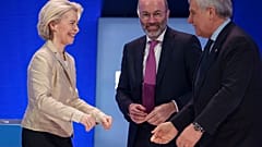Italy's Deputy Prime Minister greets EU Commission President Ursula von der Leyen as Manfred Weber smiles, at the EPP Congress