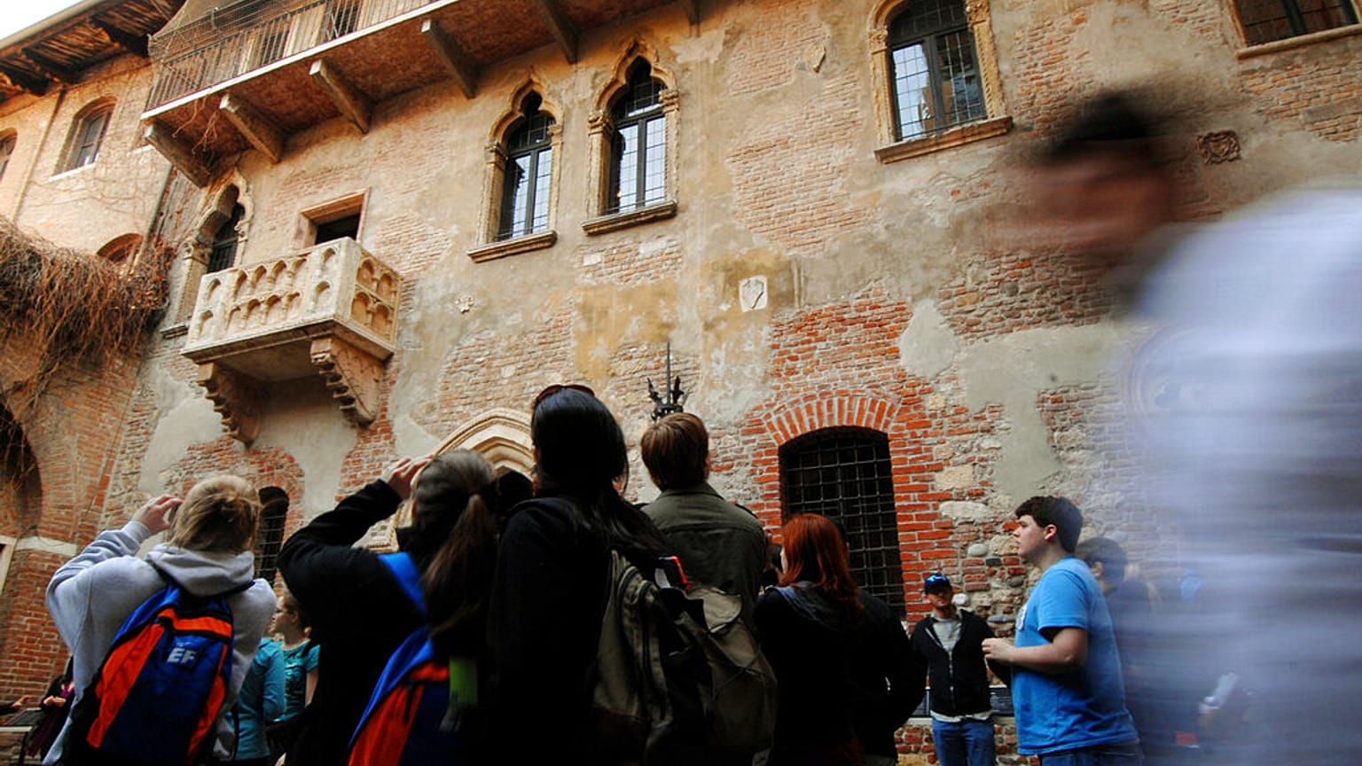 Tourists take pictures of Juliet's balcony, seen at left, in Verona, northern Italy (AP Photo/Claudio Martinelli)