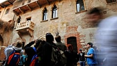 Tourists take pictures of Juliet's balcony, seen at left, in Verona, northern Italy (AP Photo/Claudio Martinelli)