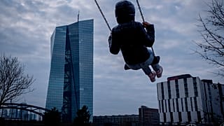 A girl swings near the European Central Bank in Frankfurt, Germany, Wednesday, March 6, 2024
